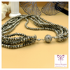 A short multi-layered chain with glass beads in shades of brown