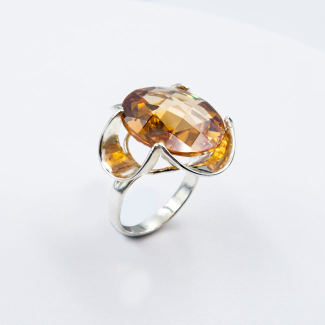Silver ring with a crystal in the shade of citrine