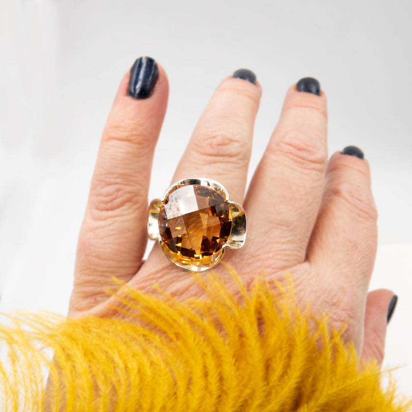 Silver ring with a crystal in the shade of citrine