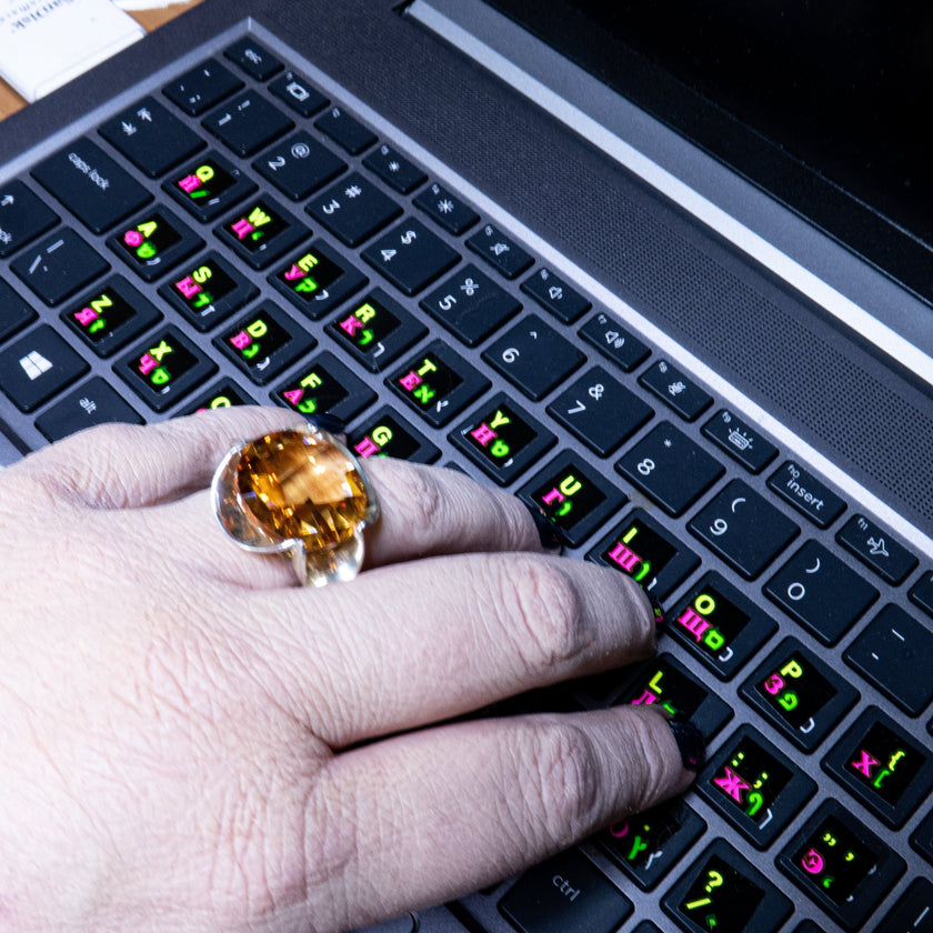 Silver ring with a crystal in the shade of citrine
