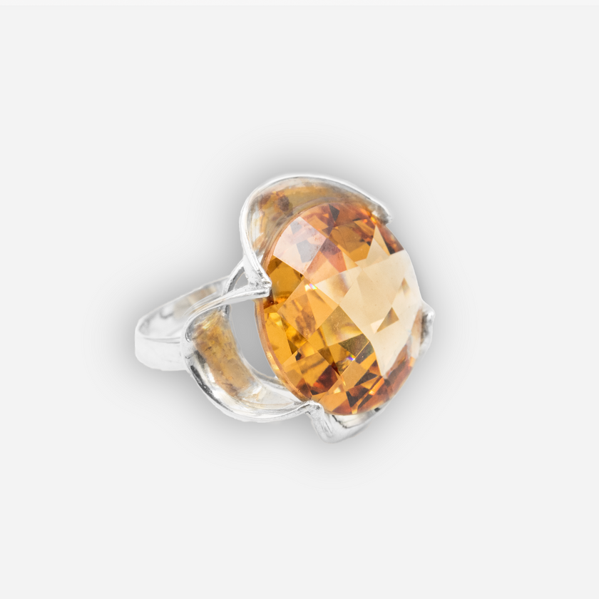 Silver ring with a crystal in the shade of citrine