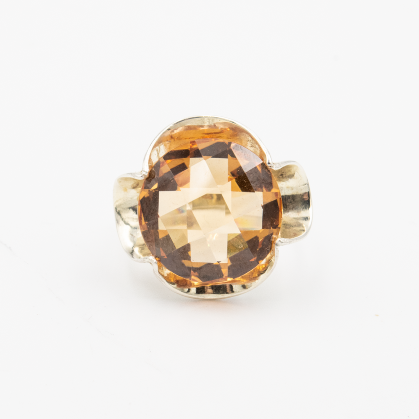 Silver ring with a crystal in the shade of citrine