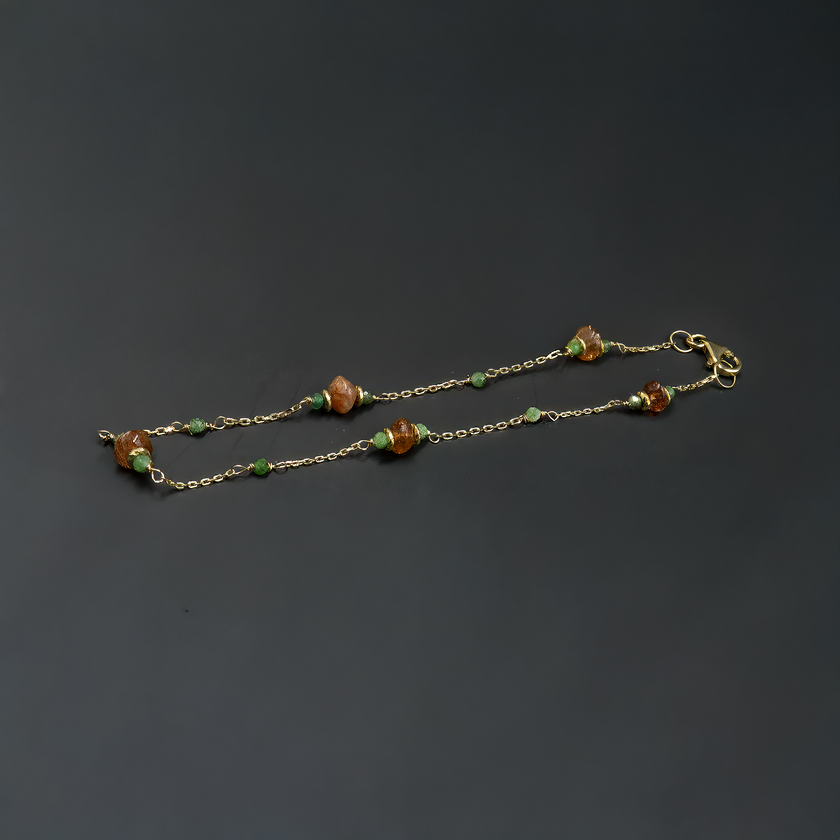 14 carat gold bracelet with sunstone and zoisite rubies