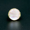 A silver ring with mother of pearl in a delicate pink shade