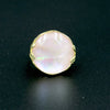 A silver ring with mother of pearl in a delicate pink shade