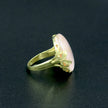 A silver ring with mother of pearl in a delicate pink shade