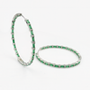 Luxurious hoop earrings with a zirconia stone in a shade of emerald