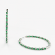 Luxurious hoop earrings with a zirconia stone in a shade of emerald