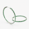 Luxurious hoop earrings with a zirconia stone in a shade of emerald