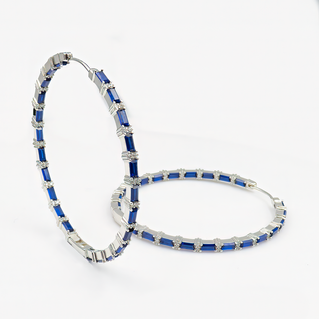 Luxurious large hoop earrings with a zirconia stone in shades of sapphire