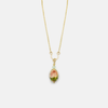 A necklace with a bead pendant in shades of green