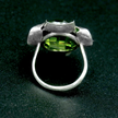 A silver ring combined with a green crystal
