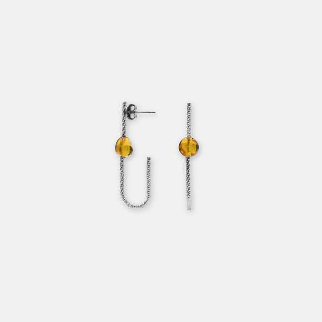 Earrings designed with amber
