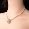 Lavender pearl necklace with butterfly shield pendant