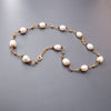 White pearl necklace and natural garnets