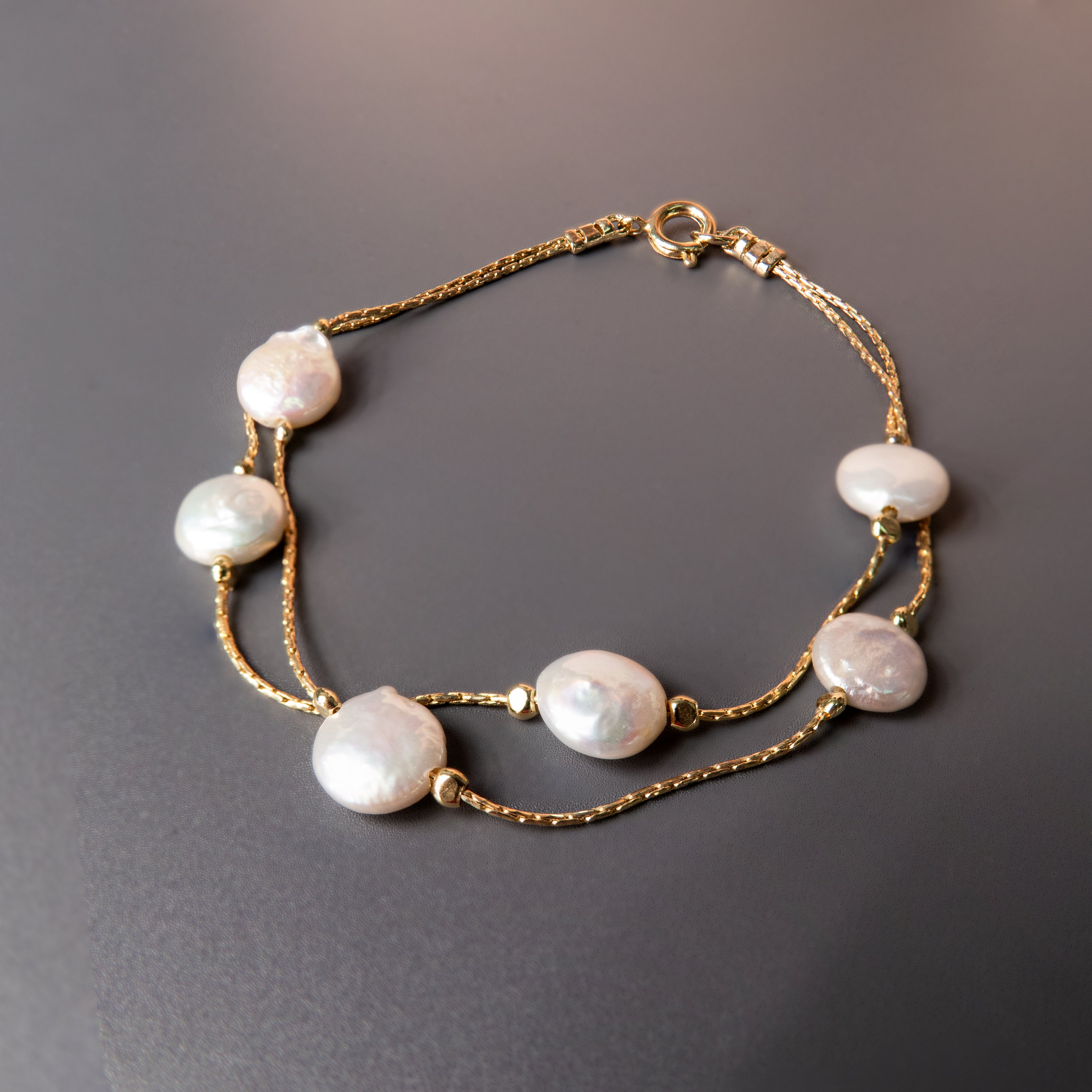 Chic and timeless cultured pearl bracelet, handcrafted with care to create a delicate and sophisticated piece of jewelry. This pearl-beaded bracelet is perfect as wedding jewelry, an elegant bridesmaid gift, or a meaningful token for any special occasion. The minimalist silver design enhances its versatility, allowing it to be worn alone or layered with other accessories. A must-have for women who love refined, classic, and stylish jewelry that adds a graceful touch to their look.
