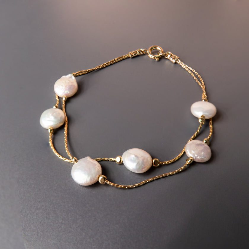 Chic and timeless cultured pearl bracelet, handcrafted with care to create a delicate and sophisticated piece of jewelry. This pearl-beaded bracelet is perfect as wedding jewelry, an elegant bridesmaid gift, or a meaningful token for any special occasion. The minimalist silver design enhances its versatility, allowing it to be worn alone or layered with other accessories. A must-have for women who love refined, classic, and stylish jewelry that adds a graceful touch to their look.