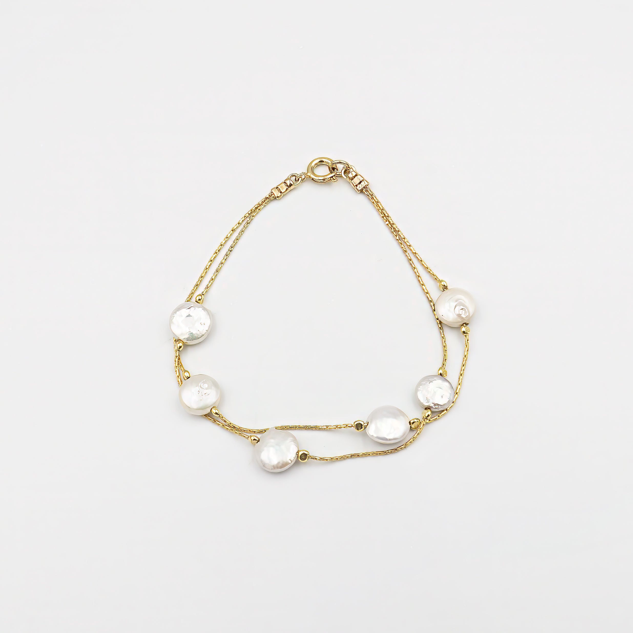 Minimalist cultured pearl beaded bracelet, designed with elegance and simplicity. Featuring high-quality pearls, this silver bridal bracelet is perfect for weddings, anniversaries, and special occasions. Its dainty charm makes it an excellent bridesmaid gift, adding a touch of sophistication to any outfit. A timeless and versatile jewelry piece that complements both formal and everyday looks, making it a thoughtful and stylish gift for women who appreciate delicate and refined accessories.