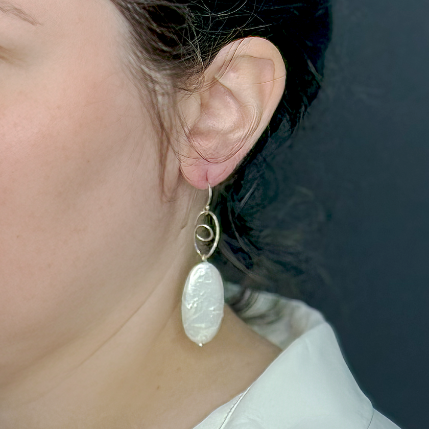 Silver earrings with oval pearl