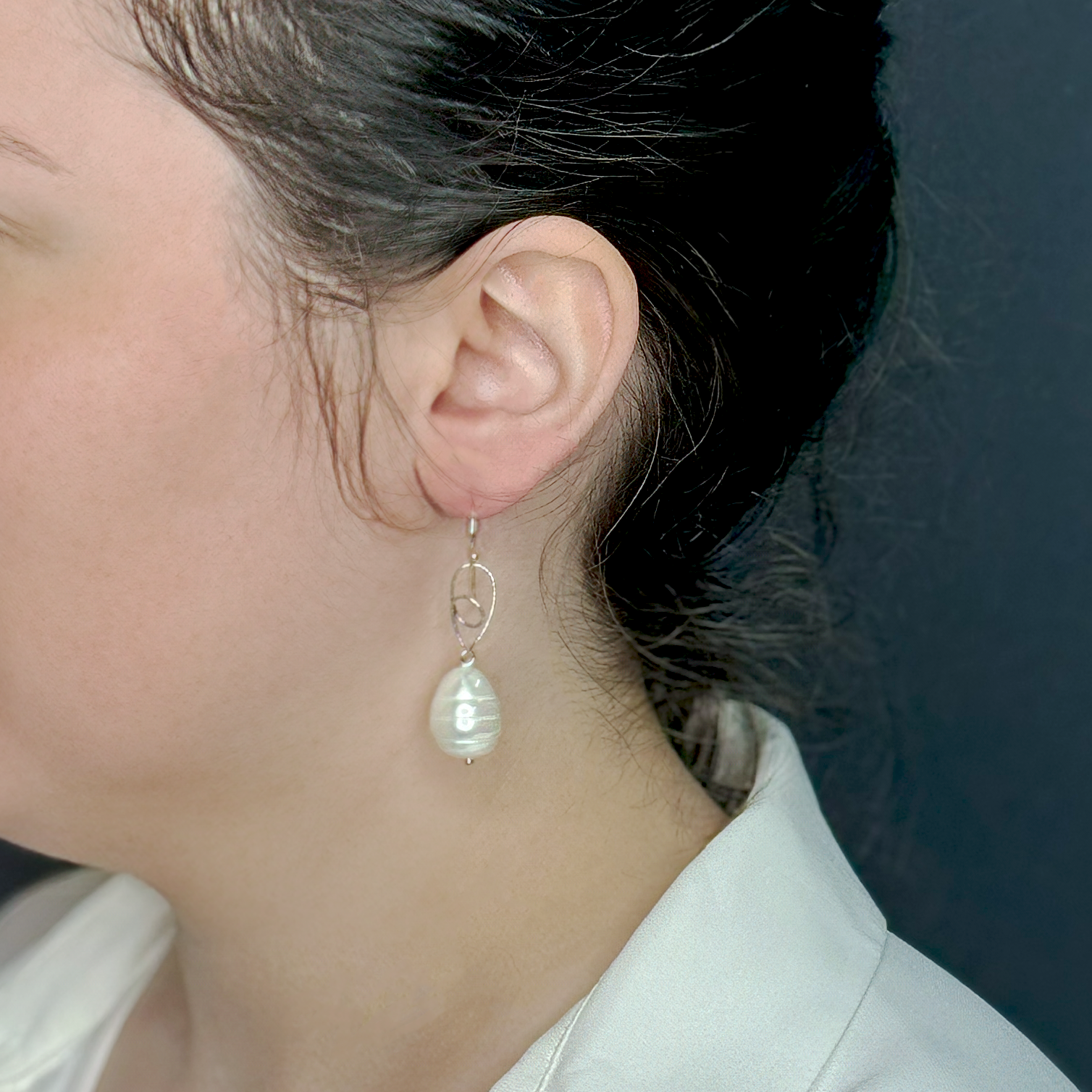 Silver earrings with a pearl in the shape of a drop