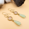 Dangling silver earrings with a pink opalite and a drop of green agate