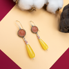 Dangling silver earrings with a pink opalite and a yellow agate drop