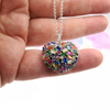 Elegant silver necklace with a multicolored heart pendant