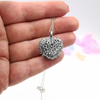 Elegant silver necklace with a multicolored heart pendant