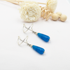 Silver earrings with a drop of blue agate