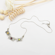 Silver pendant inlaid with citrine, olivine and garnet