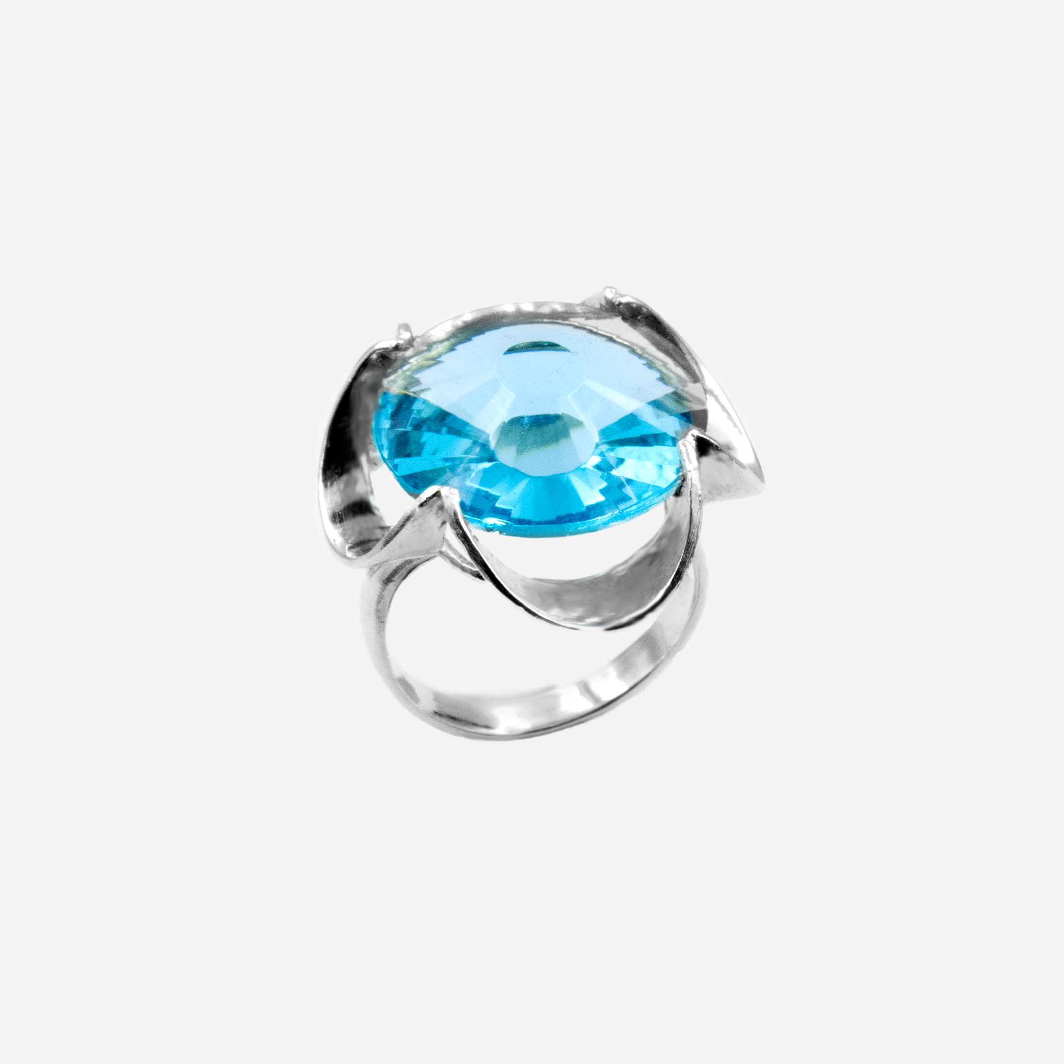 A silver ring combined with a crystal in a shade of aquamarine