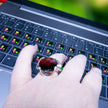A silver ring combined with a crystal in the shade of garnet