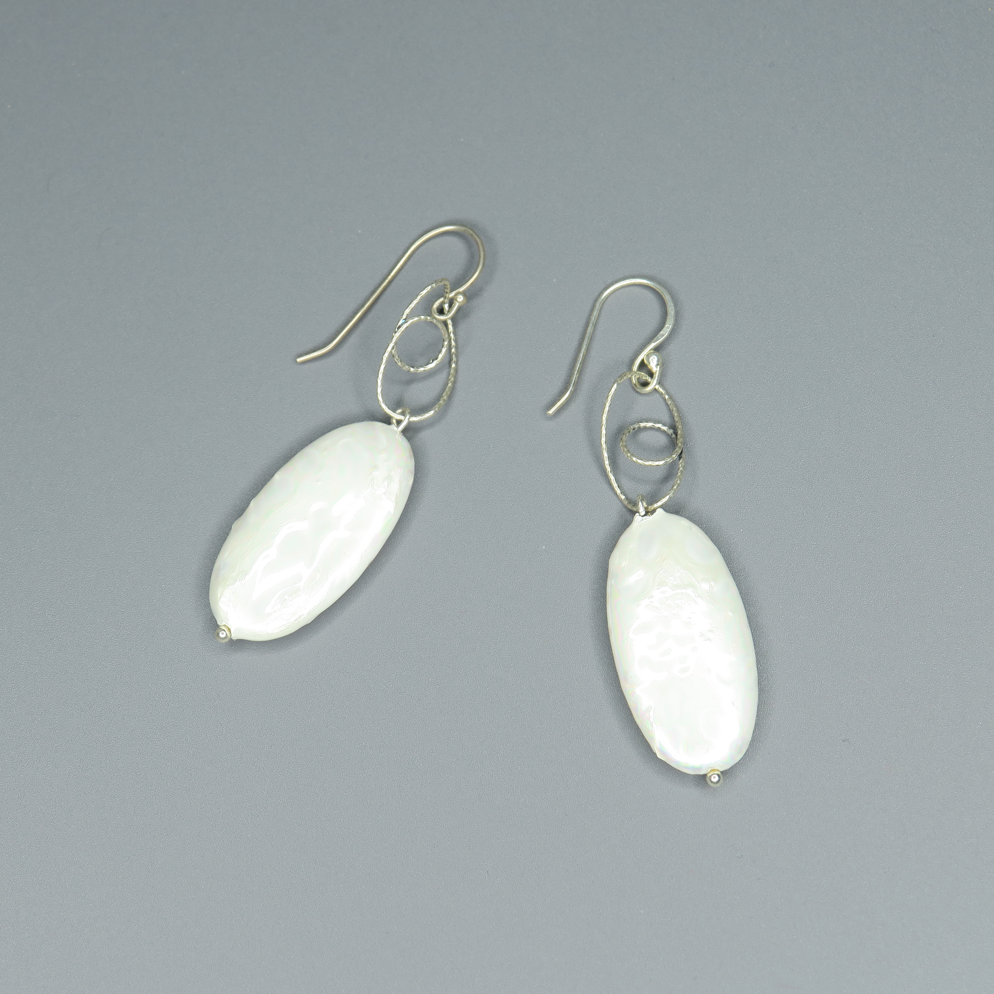 Silver earrings with oval pearl