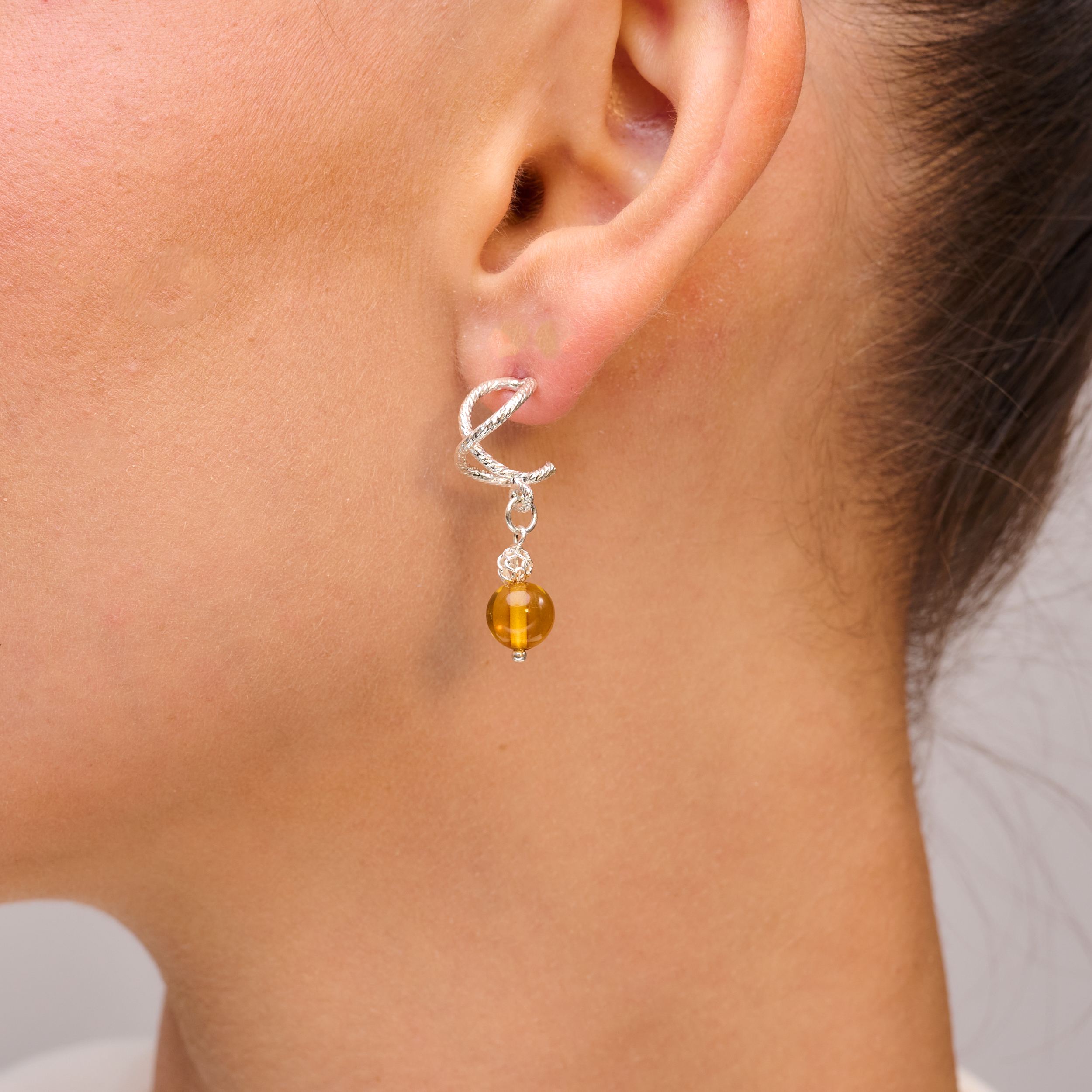 Silver omega earrings with an artificial brook pearl