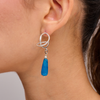 Silver earrings with a drop of blue agate